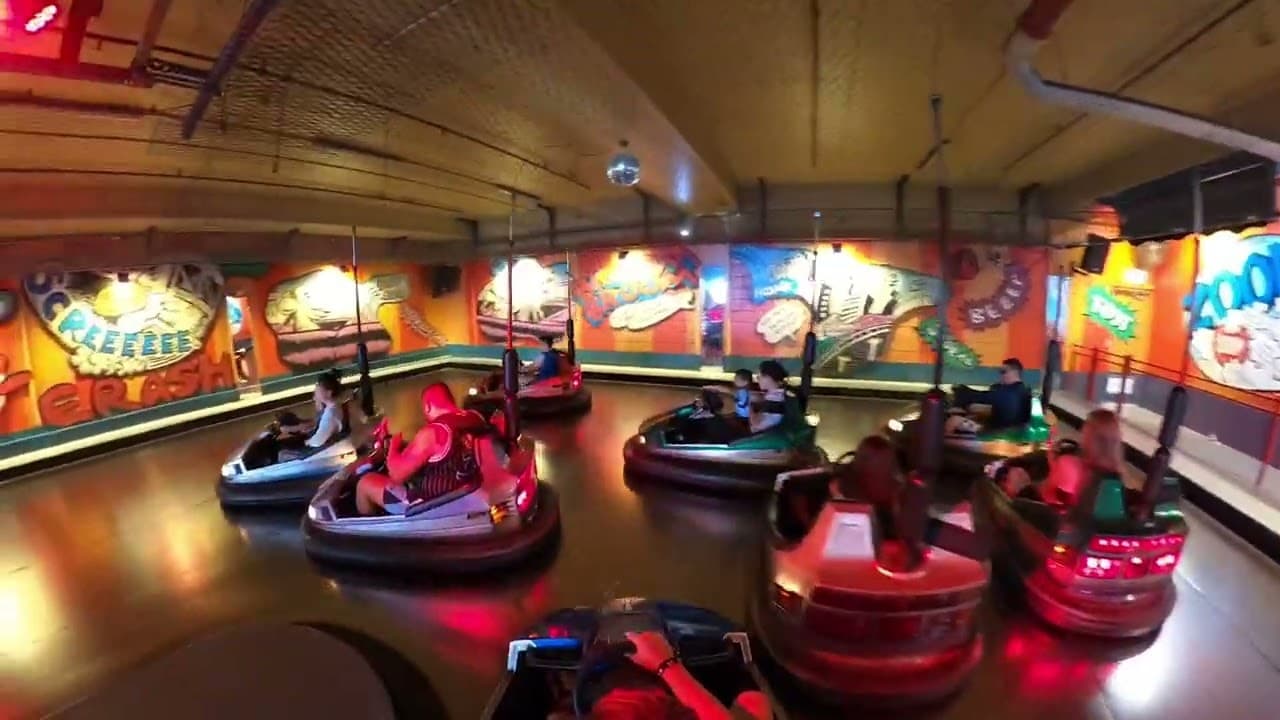 Families driving bumper cars at Dodgem City, Luna Park Sydney